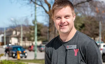Bryan Smiling in front of the YMCA