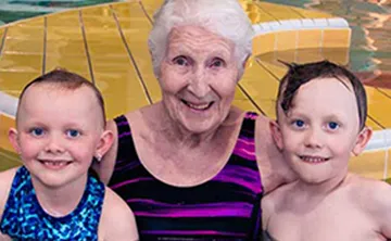 Jill in the pool with two children